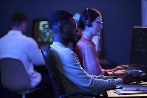 Black Man Analyzing Data on Computer in Cybersecurity Office Stock Photos