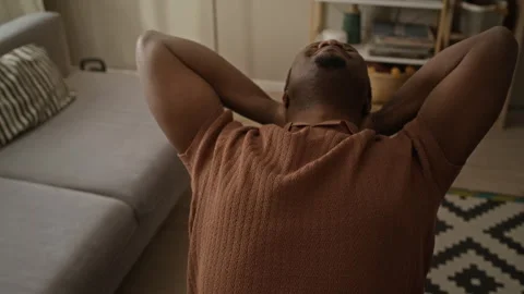 Black Man Closing Laptop and Leaning Back to Relax after Work Stock Footage 337717296