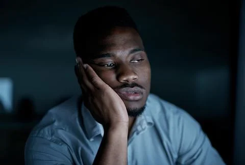 Black man, computer and bored in night office for editing, deadline and jou.. Stock Photos