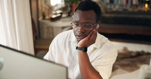 Black man, computer and tired in home for remote work, article research and Stock Footage 294825802