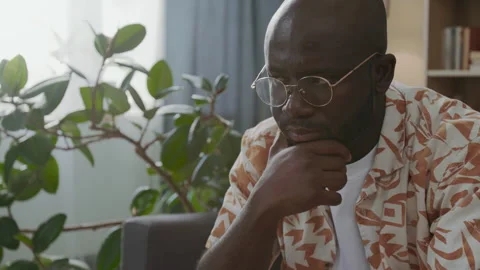 Black Man Concentrating on Chess Strategy during Training Session at Home Stock Footage 290467728