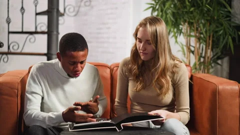 Black man confused of seeing toxic relative photo near wife Stock Footage 168920439