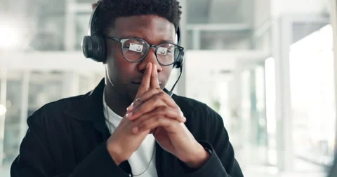 Black man, consultant and thinking with headset in office for problem solving or Stock Footage 316295145