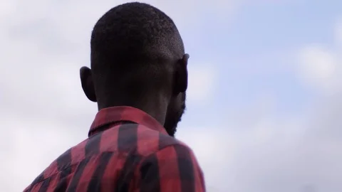 Black man contemplating the sky. future, hopes Stock Footage 90023496