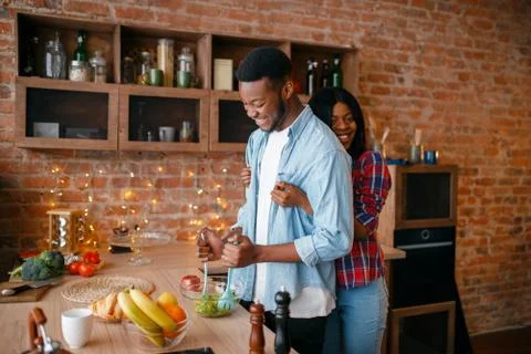 Black man cooking breakfast on the kitchen Stock Photos