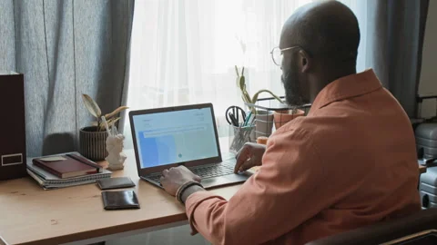 Black Man with Credit Card Viewing Exotic Resort on Booking Website Stock Footage 333281759