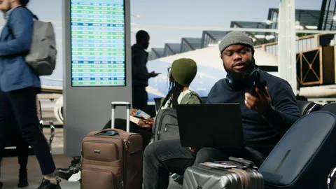 Black man in crisis mode talking on phone call to solve startup mistake Stock Footage 339643259