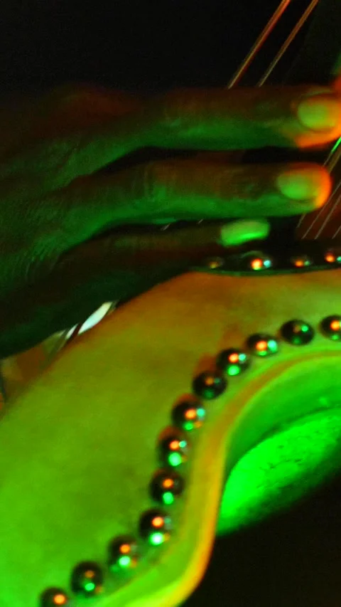 Black man dancing while his fingers are plucking the strings of kora instrument Stock Footage 230691805