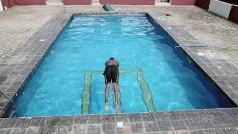 Black Man diving into a pool Stock Footage 145818329
