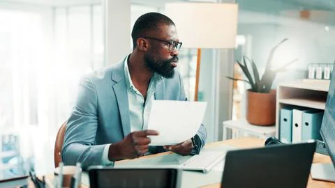 Black man, documents and confused with computer at office with glasses, rev.. Stock Photos