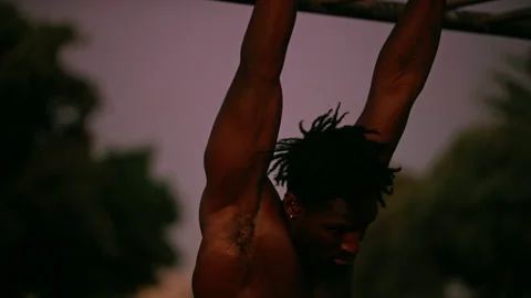 Black man doing exercise outdoors Stock Footage 279292891