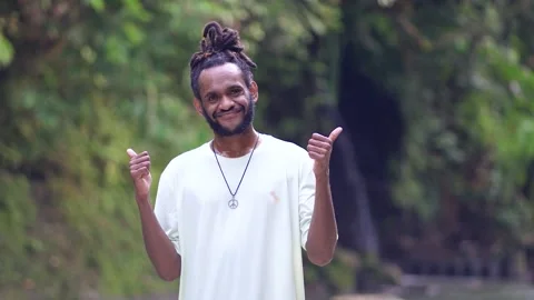 A Black Man With Dreadlocks Giving Thumbs up With Both of His Hand in The Nat Stock Footage 209175564