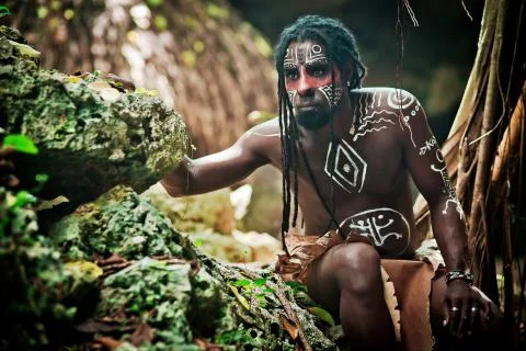 Black man with dreadlocks in the image of the Taino Indian in his habitat Stock Photos