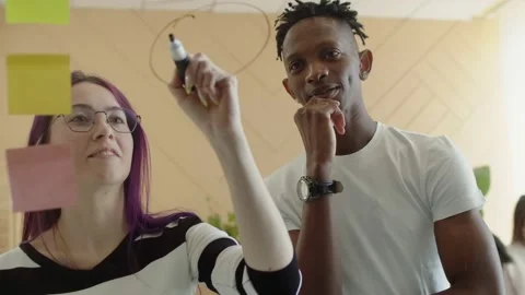 Black man dreadlocks in white T-shirt and a woman with purple hair and glasses Stock Footage 199788411