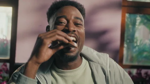 Black Man Eating and vlogging Stock Footage 275129174