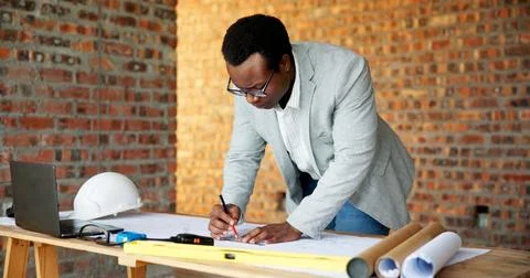 Black man, engineer and drawing at site with document, blueprint and design.. 写真素材