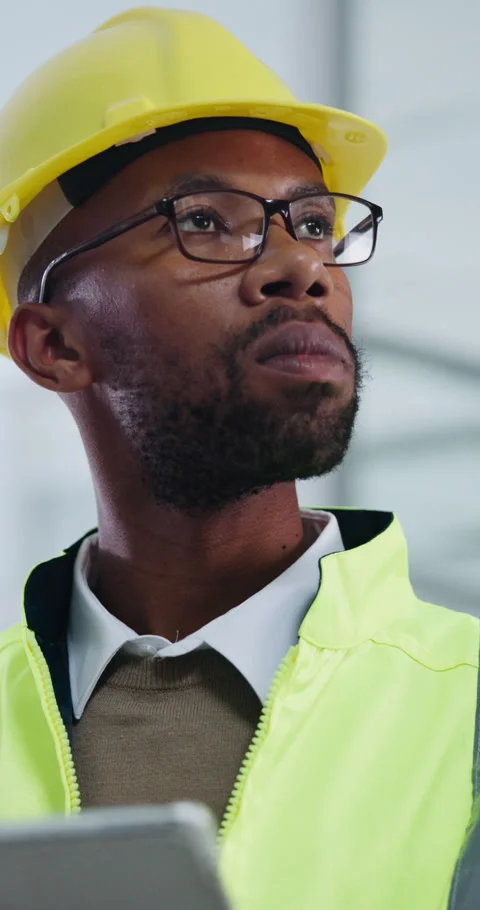 Black man, engineer and reading in office with tablet, research and schedule for Stock Footage 341378652