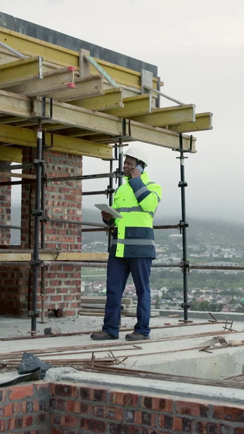 Black man, engineer and tablet at site with phone call, research and planning Stock Footage 338036489