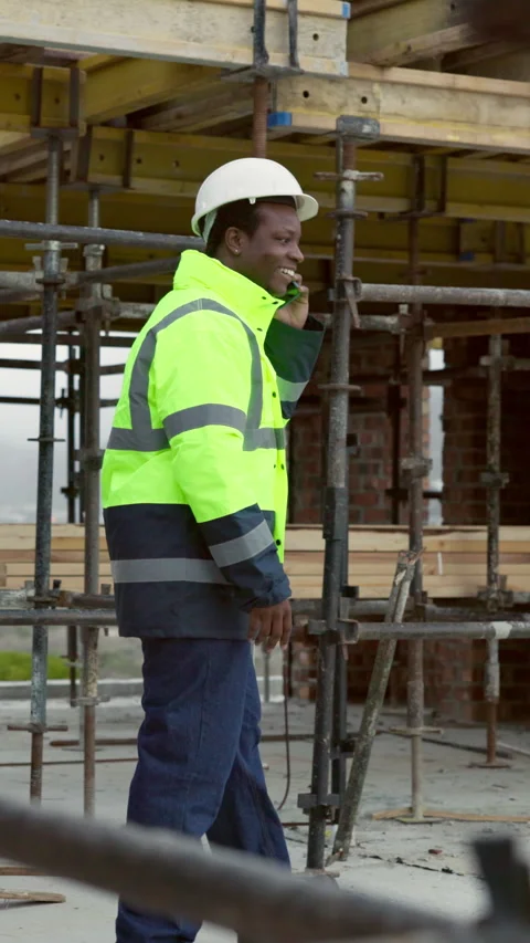 Black man, engineer and walking at site with phone call, inspection or planning Stock Footage 338039132