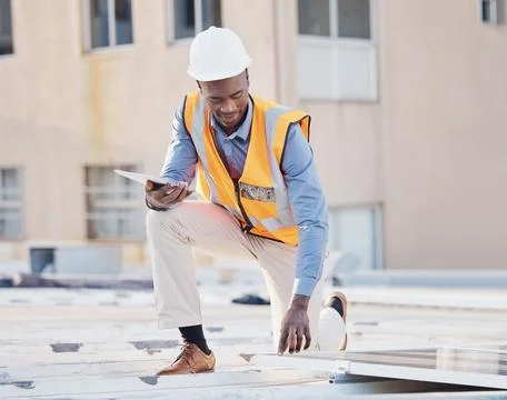 Black man, engineer tablet and solar panel grid installation of construction Stock Photos