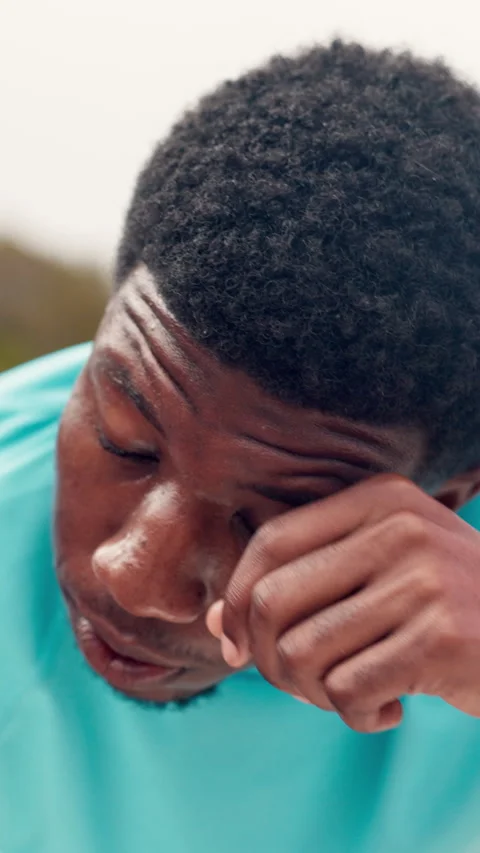 Black man, face and tired with sweat for fitness on break, exhausted and outdoor Stock Footage 330582046