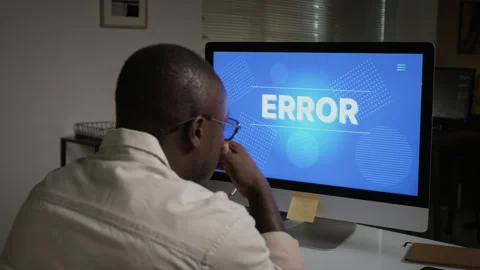 Black Man Facing Computer Error Screen with Frustration Stock Footage 348148000