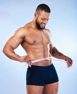 Black man, fitness and body, weightloss and measuring tape with abs, health and Stock Photos