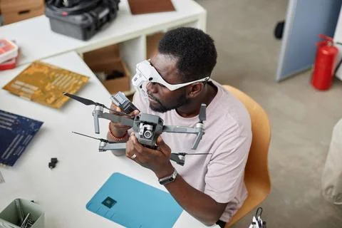 Black Man Fixing Drone in Electronics Repair Shop Stock Photos