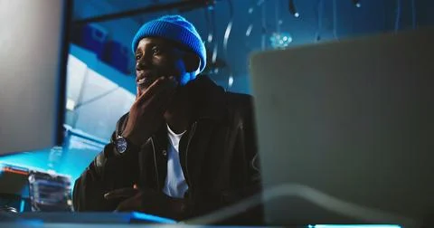 Black man, hacker and thinking with computer at night for programming, cyber Stock Photos