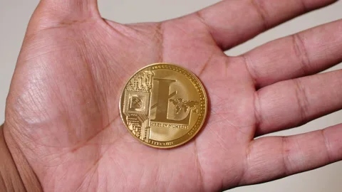 Black man hands closing around Litecoin Stock Footage 140962833