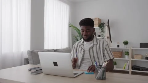 Black man having video call and working at home Stock Footage 240907883