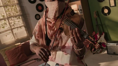 Black Man in Headscarf Performing Violin in Duo with Synth at Home Studio Stock Footage 335405023