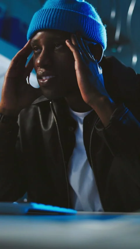 Black man, night and thinking with frustrated hacker in server room for Stock Footage 333692995