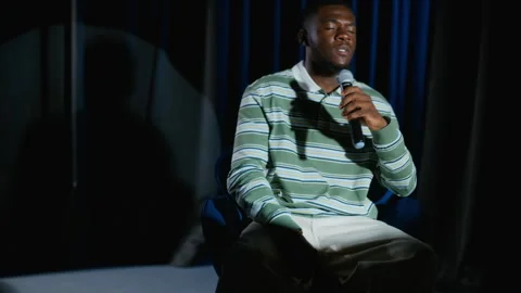 Black Man Performing Dramatic Monologue with Microphone on Stage Stock Footage 344529418