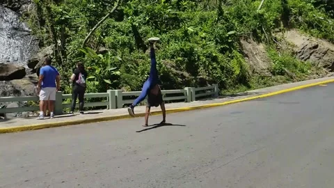 Black Man Performs Cartwheel to Front Flip on Concrete, Martial Arts Tricking Stock Footage 146564919