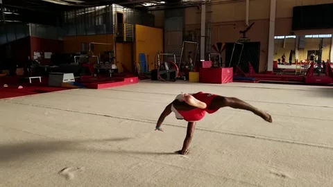 Black Man Performs Double Corkscrew in Gymnastics Gym, Slow Motion Tricking Stock Footage 146561393