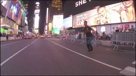 Black Man Performs Freerunning Flip in Times Square, New York Stock Footage 146552412