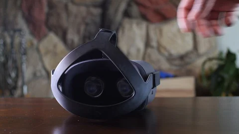 Black man picking a VR headset Stock Footage 126940440