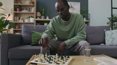 Black Man Practicing Chess Tactics at Home Stock Footage 290467176