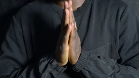 A black man praying with his hands Stock Footage 277435172
