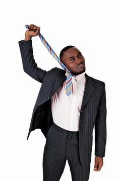 Black man pulling his tie. Stock Photos