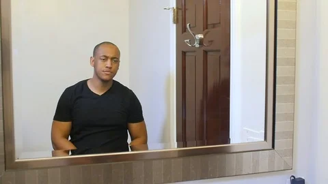 Black man putting on face mask in slow motion Stock Footage 126739038