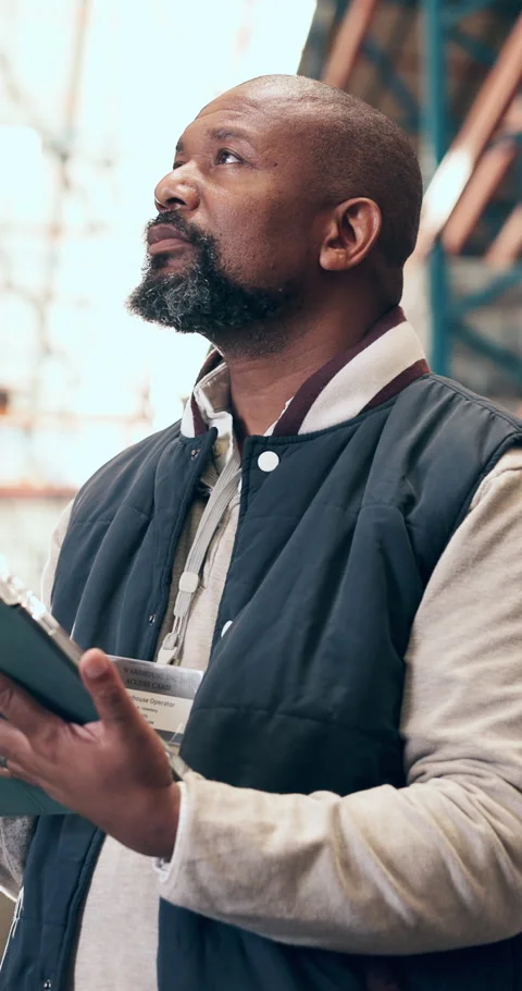 Black man, reading and tablet for logistics in warehouse for stock, inventory Stock Footage 327712582