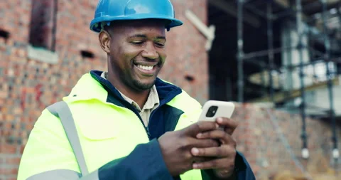 Black man, reading or phone on construction site with schedule, building app or Stock Footage 336779812