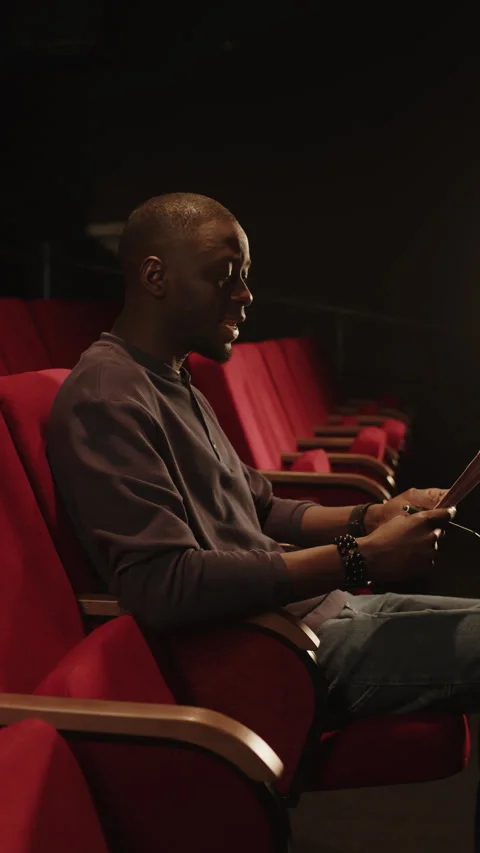 Black Man Revising Script before Auditions in Theater Stock Footage 270224752