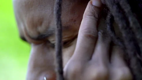 Black Man Rubs Temple in Pain from a Tension Headache or Migraine Due To Stress Video stock 142012653