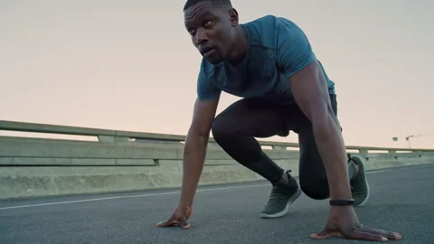 Black man, runner and start with sprint in city for fitness with form, Stock Footage 331230230