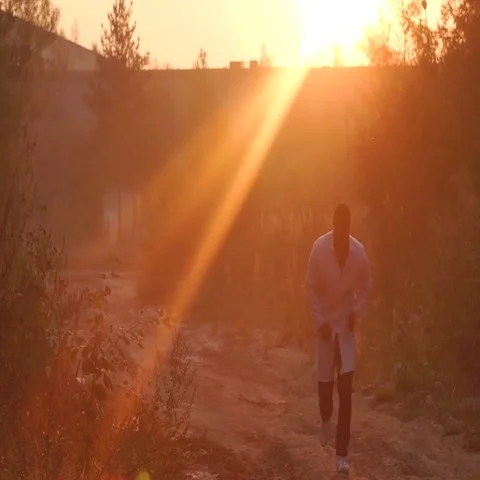 Black man running towards the sunset,sunrise Stock Footage