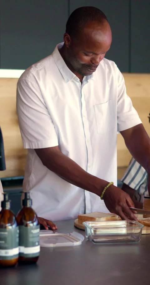 Black man, sandwich and school lunch in kitchen of home with son for nutrition Stock Footage 339047735