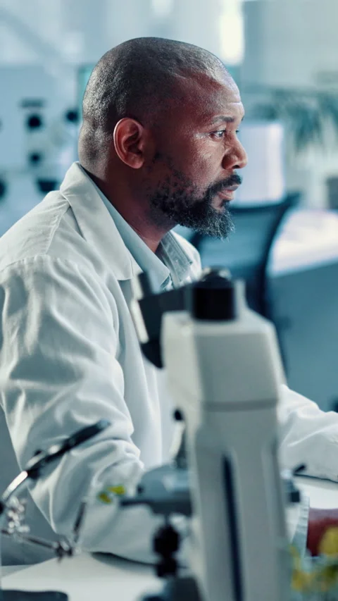 Black man, scientist and forensic research with computer for biology experiment 스톡 동영상 310605920